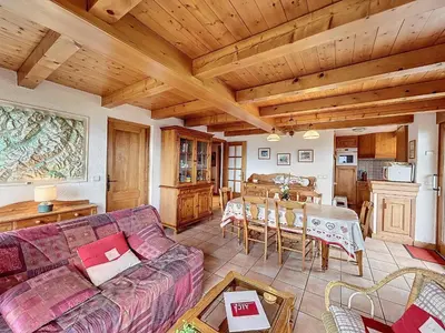 a living room with a couch and a table at Appartement 3P avec parking proche des pistes à Combloux - FR-1-560-135 in Combloux