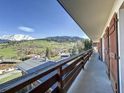 a balcony with a view of a mountain at Appartement 4 pièces avec piscine couverte à Combloux - FR-1-560-127 in Combloux