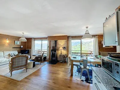 a kitchen and living room with a table and chairs at Appartement 4 pièces avec piscine couverte à Combloux - FR-1-560-127 in Combloux