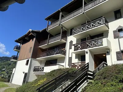 an apartment building with balconies on a hill at Mont Lachat - Central - Vues magnifiques in Saint-Gervais-les-Bains