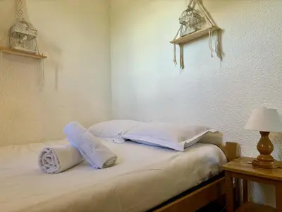 a bedroom with a bed with towels on it at Mont Lachat - Central - Vues magnifiques in Saint-Gervais-les-Bains