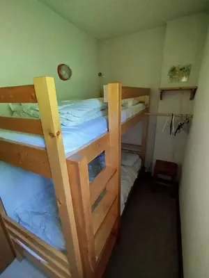 two bunk beds in a small room at Beautiful apartment near the slopes of Megève in Megève