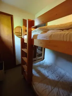 a pair of bunk beds in a room at Beautiful apartment near the slopes of Megève in Megève