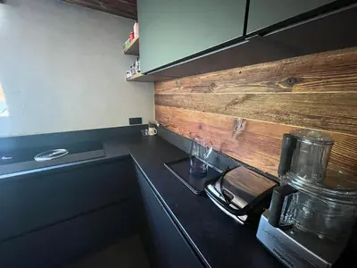 a kitchen with a counter with a coffee maker on it at Appartement Luxe comme un Chalet - vue exceptionnelle in Combloux