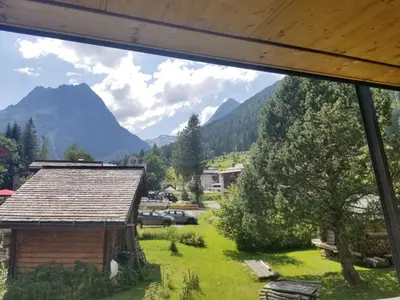 a view of the mountains from the window of a house at Chalet Walser à VALLORCINE 13 kms CHAMONIX France in Vallorcine