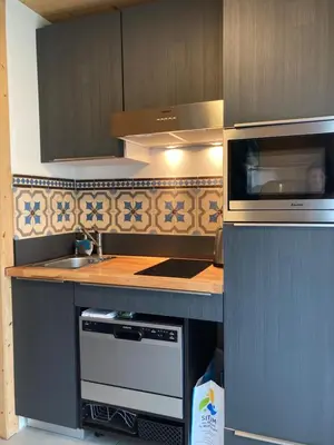 a kitchen with a sink and a stove top oven at Chalet Walser à VALLORCINE 13 kms CHAMONIX France in Vallorcine