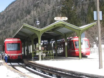 two red trains parked at a train station at Chalet Walser à VALLORCINE 13 kms CHAMONIX France in Vallorcine