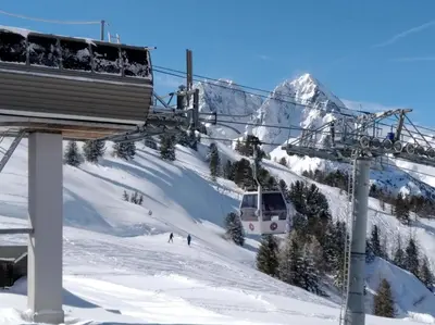 a ski lift going up a snow covered mountain at Chalet Walser à VALLORCINE 13 kms CHAMONIX France in Vallorcine