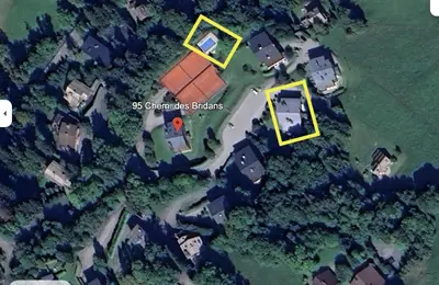 an aerial view of a mansion with a house at Appartement de standing Mont d'Arbois in Megève
