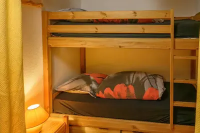 a bunk bed in a room with a bunk bedscribed at Le Névé in Saint-Gervais-les-Bains