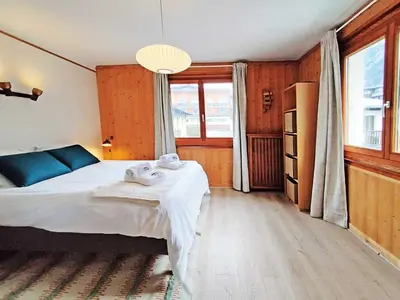a bedroom with a bed with two towels on it at Residence Edelweiss - Chamonix All Year in Chamonix-Mont-Blanc