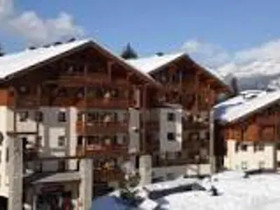 a group of buildings with snow on the roofs at Appartement 4 pièces, 6-7 pers, balcons et parking, Morillon 1100 - FR-1-815-101 in Morillon