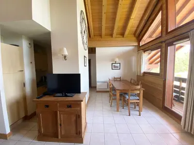 a room with a bed with two towels on it at Appartement 4 pièces, 6-7 pers, balcons et parking, Morillon 1100 - FR-1-815-101 in Morillon