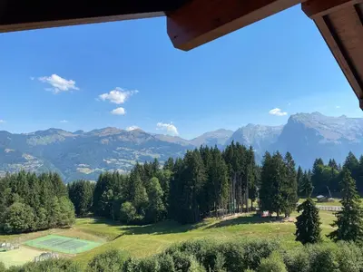 a small bed in a room with a wooden ceiling at Appartement 4 pièces, 6-7 pers, balcons et parking, Morillon 1100 - FR-1-815-101 in Morillon