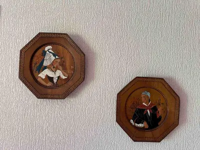 two pictures of a man and a woman on a wall at Appartement 6p à Samoëns avec parking, proche télécabine - FR-1-642-90 in Samoëns