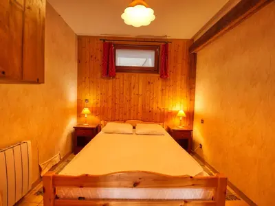 a bedroom with a large bed with two night stands at Appartement 6p à Samoëns avec parking, proche télécabine - FR-1-642-90 in Samoëns