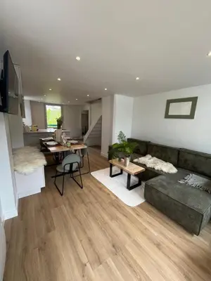 a living room with a couch and a table at Residence VARLOPE in Chamonix-Mont-Blanc