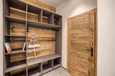 a room with a wooden closet with a wooden door at Chalet mitoyen - Jacuzzi - Cousinade I in Les Contamines-Montjoie