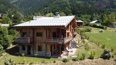 an aerial view of a house in a field at Magnifique chalet mitoyen - Jacuzzi - Cousinade II in Les Contamines-Montjoie