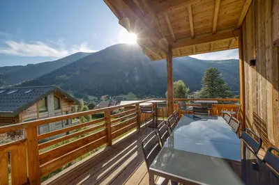 a balcony with a view of a mountain at Magnifique chalet mitoyen - Jacuzzi - Cousinade II in Les Contamines-Montjoie