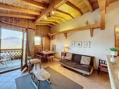 a living room with a couch and a table at Appartement 3 pièces tout équipé avec balcon et box fermé, à 1,2 km du centre de Combloux - FR-1-560-141 in Combloux
