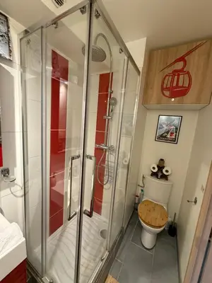 a shower stall in a bathroom with a toilet at CHAMONIX Centre - Studio de charme avec parking, Vue sur le Mont-Blc in Chamonix-Mont-Blanc