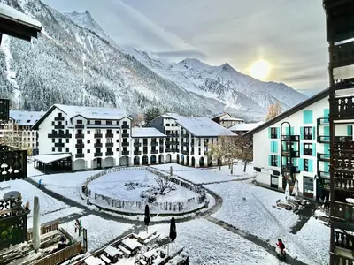 a resort in the mountains with snow on the ground at CHAMONIX Centre - Studio de charme avec parking, Vue sur le Mont-Blc in Chamonix-Mont-Blanc