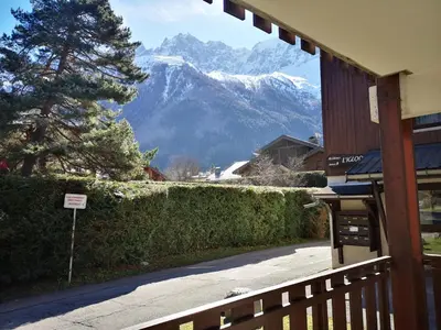 a view of a snow covered mountain from a porch at Chamonix, studio de 24 m2 in Chamonix-Mont-Blanc