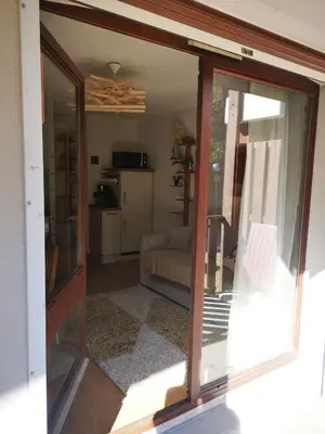 a view of a living room with sliding glass doors at Chamonix, studio de 24 m2 in Chamonix-Mont-Blanc