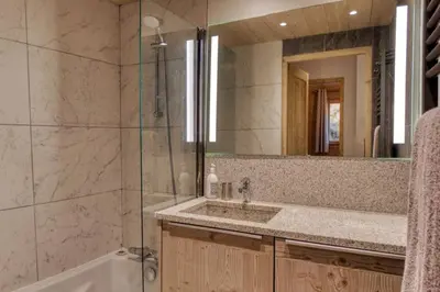 a bathroom with a sink and a shower at MGM Charles Delys - 3 Rooms - Les Houches in Les Houches