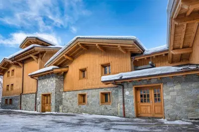 a house with snow on the roof at MGM Charles Delys - 3 Rooms - Les Houches in Les Houches
