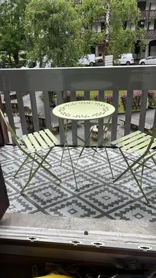 a table and two chairs sitting next to a fence at STUDIO DENT DU CROCODILE, AIGUILLE du MIDI, BALCON, PARKING in Chamonix-Mont-Blanc