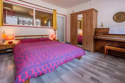 a bedroom with a bunk bed and a ladder at In the center of Chamonix with views of Mont Blanc in Chamonix-Mont-Blanc