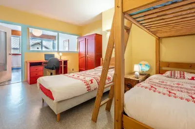 a kitchen and a dining room with a table and chairs at In the center of Chamonix with views of Mont Blanc in Chamonix-Mont-Blanc