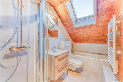 a bathroom with a toilet and a sink and a shower at Chalet L'Argoat - Warm and cosy 6 bedroom chalet in Chamonix-Mont-Blanc
