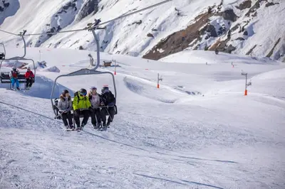 a group of people on a ski lift in the snow at Appartement Le Grenier - Happy Rentals in Chamonix-Mont-Blanc