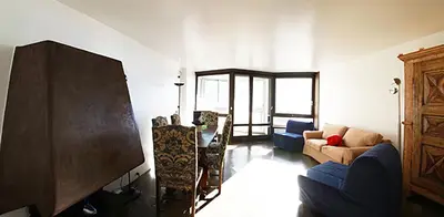 a living room with a couch and a flat screen tv at Apartment in Chamonix in Chamonix-Mont-Blanc