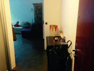 a hallway with a living room with a couch at Apartment in Chamonix in Chamonix-Mont-Blanc
