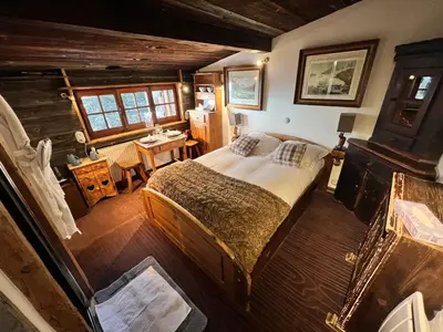 a bathroom with a sink and a shower and a mirror at Hôtel Les Chalets de Philippe avec Jacuzzis Privatifs in Chamonix-Mont-Blanc