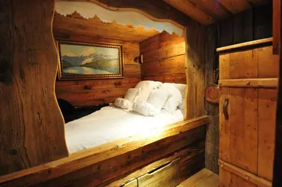 a bed in a room with a star ceiling at Hôtel Les Chalets de Philippe avec Jacuzzis Privatifs in Chamonix-Mont-Blanc