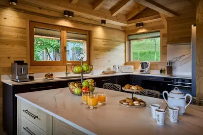 a kitchen with a counter with fruit on it at Chalet Anselme - OVO Network in Cordon