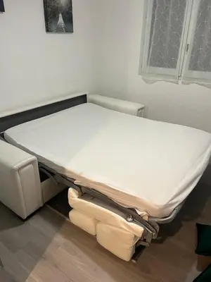 a hospital bed sitting in a room with aermott at studio station des carroz d'arraches in Arâches-la-Frasse