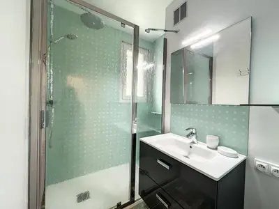 a bathroom with a sink and a shower at Chamonix : Appartement 63 m², 6 pers, Confort & Wifi - FR-1-507-78 in Chamonix-Mont-Blanc