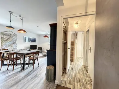 a dining room and kitchen with a table and chairs at Chamonix : Appartement 63 m², 6 pers, Confort & Wifi - FR-1-507-78 in Chamonix-Mont-Blanc