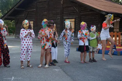 a group of girls dressed in costumes standing in a parking lot at Chalet de Denis luxe alpin et emplacement ideal à Megeve in Megève