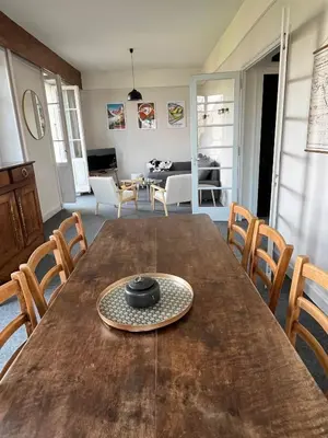 a bowl on a wooden table in a living room at Appartement vue Mont Blanc in Combloux