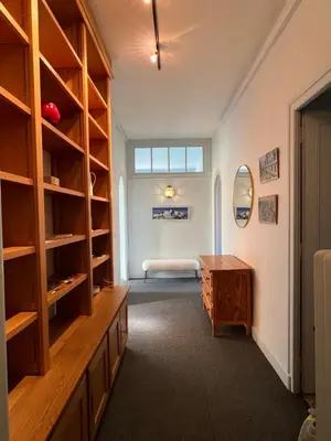 a room with a desk and a bed in a room at Appartement vue Mont Blanc in Combloux