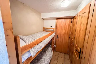a small room with two bunk beds in it at Charming T2 in Saint-Gervais-les-Bains in Saint-Gervais-les-Bains