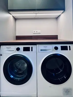 a white washer and dryer in a kitchen at Les hirondelles in Passy