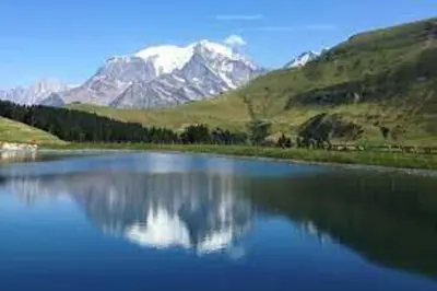 a large body of water with mountains in the background at T2 with pool in Saint-Gervais-les-Bains in Saint-Gervais-les-Bains